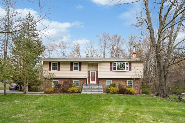 Situated on .7 acres, this move-in ready home has the space you have been looking for. The stone steps lead to the foyer to welcome guests. A spacious living room with wood-burning fireplace and ample natural light opens to the eat-in-kitchen. Enjoy cooking meals in the updated eat-in-kitchen appointed with granite counters, stainless steel appliances, ample cabinet storage, full-sized dining area, and access to the deck. Entertain and BBQ on the deck, overlooking the backyard. The deck has direct access to the backyard. Retreat to the primary bedroom featuring ensuite bath. 2 more spacious bedrooms with ample closet storage, and an updated hall bathroom complete the main level. Expansive lower-level family room has ample natural light, sliding glass doors to the backyard. and full bathroom. A private lower-level office is great for remote work, guest space, or den. Some images have been virtually staged. This home is registered with the exclusive 100% Money Back Guarantee program.