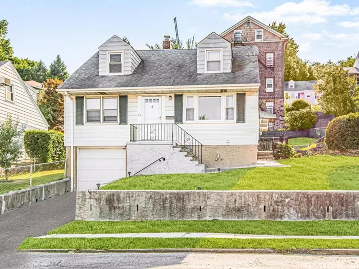 Welcome home to this classic Cape Cod home in the heart of North-East Yonkers. Upon the gracious entry, the living room features excellent hardwood floors with excellent amount of natural light. Potential awaits this sun filled kitchen with newer appliances and off counter kitchen dining set up. Off the kitchen is a door out to spectacular oversized yard and patio. First floor includes a spacious primary bedroom with updated bathroom along with a secondary guest room. Second Floor includes two (2) additional bedrooms and a newly renovated bathroom. Bonus: Many possibilities await you for the lower level which has over 590 square feet of additional space along with a laundry area. This home has much to offer including new hot water heater, new washer and dryer, newer heating system, unbelievable grounds, some rooms freshly painted, crafty stonework and so much more.  Updates throughout the house included a newer roof-(7 years old), new plumbing, new upgraded electric, new garage doors and new oil furnace heating/hot water combo unit. Come relax on the front terrace or enjoy your own private oasis in the bright tranquil back yard. Just perfect to entertain with family and friends. These super low taxes coupled with the close proximity to buses, trains, shopping centers and 40 min to Manhattan, make this a great place to call home. This Gem comes equipped with (Leased) 14 solar panels perfect to save you energy bill.