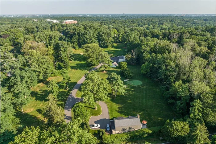 Luxurious 6.55-acre estate located in prominent Old Westbury. Located near Glen Oaks & Old Westbury Golf Course and within one hour from New York City, this four-bedroom home offers spectacular views of lush property from every room. This expansive estate includes a 3-hole golf course and an exquisitely landscaped backyard & pool designed for outdoor entertainment. Sporting a dramatic spiral staircase emersed in natural light with floor-to-ceiling glass doors, this home has large windows in every room to enrich the ambiance of this must-see property. Also included are generous storage and closets throughout the home and a colorfully finished basement ideal for a home gym or family den. Not to mention a newly constructed 3 bedroom/4 bath cottage with a charming front porch and gas grill, enriching the property for the perfect outdoor experience. This cottage could be suitable for a lavish guest house, caretakers&rsquo; home, or rental property!