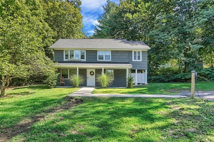 Move right into this completely renovated colonial on a flat lot at the base of the Putnam Lake neighborhood and steps to the New Fairfield border. The entire interior was essentially rebuilt with a new kitchen, baths, flooring, windows, doors, roof, water filtration system, central air conditioning and numerous other updates. First floor consists of an appealing front porch which walks into an open living room and dining area, kitchen with custom cabinets, quartz countertops, black stainless steel appliances with double ovens/beverage fridge and pantry closet. The laundry area, 1/2 bath, utility room and sliders to the patio and fenced in yard complete this level. The second floor offers a nice-sized primary bedroom with large walkin closet, second bedroom, full bath, open space and an enclosed porch/3 season room with access to the second floor deck. Large driveway easily accommodates 6 cars and has an electric charger hookup (charger not included). Must see to appreciate!!