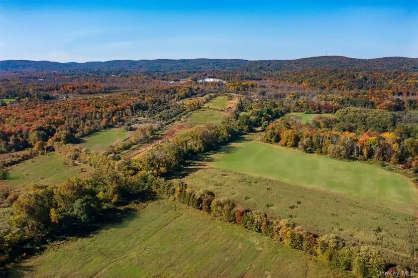 Land of opportunity! A magical 558+ acre parcel of land, 90 minutes from Manhattan, offers endless possibilities as a sprawling, fun-filled family compound or commercial facility with enormous potential. Level terrain, extensive trails, pastures and meadows are a natural for an exceptional equestrian facility (private or commercial), ATVs and hiking and as well as vineyard or farm. Currently used as a private family hunting property for deer, bear and duck, the land boasts an extensive list of location choices over multiple terrain/food plot types depending on the time of year and hunting season. Adjacent to the Great Swamp, Mother Nature has provided great natural habitat for waterfowl and big game alike. In addition, an impressive series of water impoundments were developed to create ponds for waterfowl and other wildlife, ideal for hunting enthusiasts. The water impoundment system is fed by a fresh water well that produces approximately one million gallons per day (an amazing asset on its own for future development of the parcel), flooding specific areas of the property to create nine ponds on the property. Conversely, this impressively sustainable impoundment system can be drained, releasing the water back onto the property and restoring the ponds to dry land for growing next year&rsquo;s crops. The impoundment system (rarely installed on private property due to cost) gives the land increased versatility ponds when desired during hunting season, and the quick return to the property&rsquo;s original terrain when the water is released. Not only can the Dutchess County property so convenient to Connecticut and Westchester--easily accommodate a first-class hunting club or lodge, it could also be used for agricultural farming, raising livestock, vineyard opportunities, residential compound and more. A must-see rare parcel with nearly limitless opportunity. Located just off Route 22 in Pawling, NY