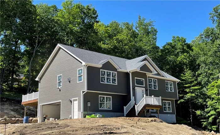 Spectacular New Construction... Last Lot TO BE BUILT in prestigious Eagle Hill - gorgeous private community of NEW homes. Mahopac School District. This home, on Lot #5, has a total 3 Bedrooms (lives like a 4 BR) and 2 Full Baths. Homes Features dynamic Open Floor Plan, 14 ft. Ceilings, huge Center Island Eat-In Kitchen, Living/Family Room with Fireplace & Sliding Glass Doors to large Deck. Spacious Primary Bedroom Suite with Full Bath & huge Walk-In Closet. Laundry on Main Level. Central A/C. Dual Heat Pump - you&rsquo;ll save a fortune! Super High Efficiency Spray Foam Insulation. 2-Car Garage and large separate Workshop! Experienced Builder. Time to make this your dream home. (Interior photos shown are of a neighboring model, identical floor plan, similar finishes.)