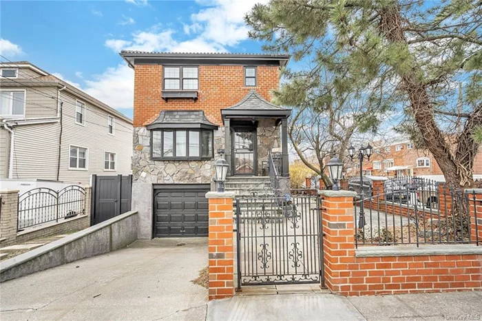 Completely renovated brick & stone Colonial in Country Club area of the Bronx. This elegant home features a living room with beamed ceilings, electric fireplace with custom mantel, Quartzite stacked stone wall and built-in bookcases. Plus, wide-plank wood floors, surround sound and recessed lighting. Open flow to the dining room with exposed brick wall, sliders to Trex deck with pergola. Designer kitchen: custom cabinetry, soft close drawers and honed Calcutta marble counters, 36 Wolf range 4-burners, griddle & convection oven, custom metal exhaust hood, pot filler faucet, French style refrigerator & wine refrigerator. Upstairs, Primary suite vaulted beamed ceiling, skylight, en-suite bath,  2 additional bedrooms, hall bath, washer/dryer. Finished lower level offers separate entrance, living area, kitchen, bedroom, full bath, sliders to patio, private yard. New Mediterranean style Roof, New Gutters, New Andersen Windows, Updated Electric Panel, Heat/CAC, Hot Water Tank.