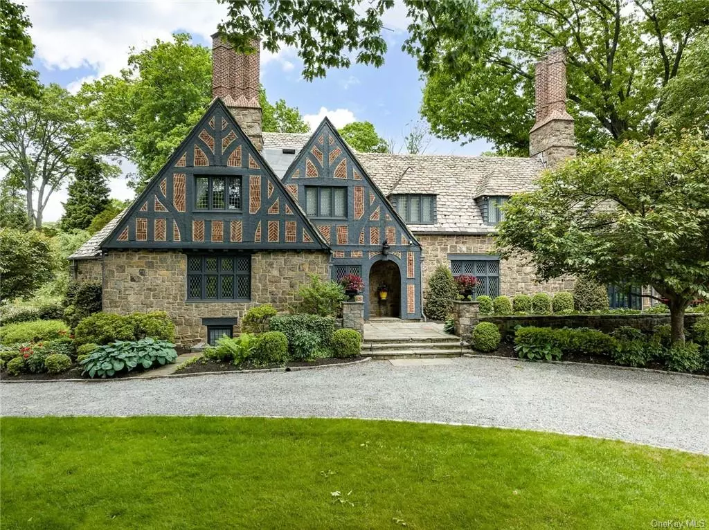 A win-win: this best-in-class Tudor has been recently enhanced by meticulous renovations and restoration which retains all the original character, lush landscaping, and curb appeal while introducing 21st century comfort, convenience, and state-of-the-art app technology. Taking this resort-caliber property to the next level: a just renovated pool with premier pebble tech finish, top-of-the-line Pentair equipment, salt generator system and LED lighting, all integrated with smart home technology. Featured as a stunning backdrop in numerous recent HBO and NBC TV productions, Terry Manor was built in 1935 by renowned architect Lewis Bowman in the heart of Lawrence Park West, an enclave distinguished by iconic architecture and proximity to the idyllic Bronxville Village with its easy express train to NYC. Top-of-the-line amenities include new double-insulated leaded-glass windows, Rohl and Numi bath and kitchen fixtures, and an exquisite array of artisanal tile and stonework, video security, smart bath, heating and lighting controls. From the gracious entry with limestone floors and Cuban mahogany paneled living room to the meticulously sourced bespoke kitchen with mahogany and Calcutta Oro details, designer appliances and adjacent family room with custom cabinetry, as well as a sunny home office, this magnificent home offers unparalleled luxury. Upstairs, the main bedroom features cathedral ceilings, wide-plank white oak floors, a drink station, and a spa bath with sauna, radiant heat, black granite soaking tub, walk-in glass shower; and a custom-fitted boutique dressing room with a second spa-quality bath with steam shower. Privacy for all comes courtesy of two newly-restored bedrooms and a new guest suite. Al fresco entertaining is second nature via the pool, barbeque and wrap-around slate terrace. A priceless opportunity to own a property of celebrated provenance with world-class upgrades!