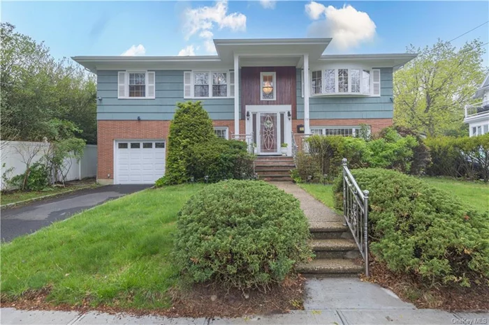 So much curb appeal on a quiet, one-way street. 28 Winfield Ave. Mount Vernon, NY. Immaculate high ranch w/two story entry. Main floor FLR, FDR, delightful MEIK w/granite counters, gas cook top w/stainless exhaust hood, built-in oven, built-in microwave, dishwasher, custom wood cabinets w/lots of storage. MBR/double closets/access to updated hall bath. BR, BR. Lower level perfection w/second large LR, second kitchen w/electric range and refrigerator. BR, updated hall bath and generous laundry room. Hardwood floors. Wall unit a/c. Attached one car garage. Private, level yard w/patio and shed. A very special home in a convenient location, close to the town of Fleetwood w/shopping, restaurants and outdoor recreation. Close to MetroNorth and parkways for an easy commute. This property may qualify for a $5, 000 Chase Homebuyer Grant that can be used to reduce the cost of your Chase mortgage.