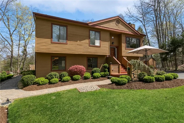 Lovingly and meticulously maintained over the last forty years by the current owner - this 2, 080 St Ft Cortlandt Manor contemporary split level is a true find. First time ever on the market, special features include 3 bedrooms, 3 full bathrooms, 1, 260 Sf Ft of living space upstairs with cathedral 14ft ceilings in the Living, Dining, Kitchen, Foyer and Primary En-Suite Bed room. The 820 Sq Ft pristine condition, fully finished above grade lower level has 8ft cielings, standard height livingroom windows and directly connects to entry foyer, attached - heated 1 car garage with heated laundry room and has exterior access to the side yard. Immediately when pulling up the drive the pride of ownership is obviously with well manicured grounds featuring ornimental Boxwoods, a Weeping Blue Atlas Cedar and Japanese Maple. Green grass provided by the lawns automatic sprinkler systems. Outdoor living at its best with a full walk out deck off the kitchen sliding doors and a large backyard stone patio with custom propane fire pit and, decorative rock walls, pebble paths, feature landscaping and privacy fencing. Move right in with Verizon Fios, ADP Alarm Hardware, electrical, siding, roof, utilities and windows all updated or good condition. Gas generator, laundry water conditioner, overhead lighting and fireplace equipment all included. Quick drives to Cortlantd and Croton-Hamron MTA Commuter Trains, Blue Mountain Park, Charles Cook Recreation Center Park, Peekskill Bars and Cafes and The Village of Croton On Hudson.