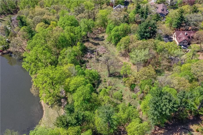 Halsey Pond is in the back of the property, so you have the potential of lovely water views with enough space and buffer area for privacy and peace.