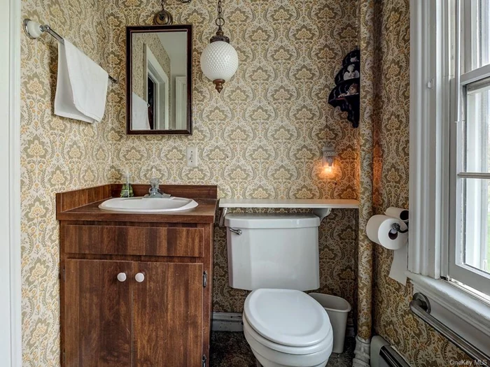 Upstairs bathroom with newer shower.