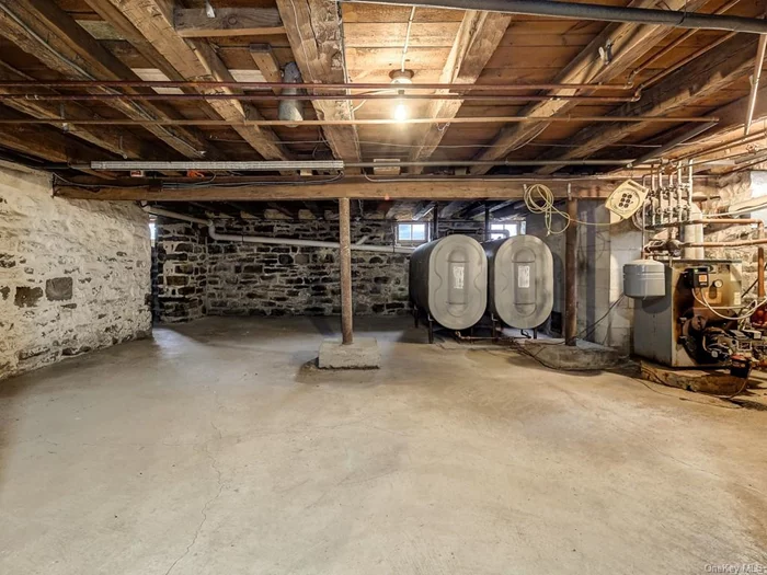 This basement is dry!! two 300 gallon oil tanks, 5 zone heat. Bilco doors to backyard.