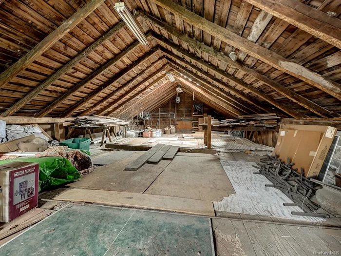 Walk up attic over part of the garage/barn.