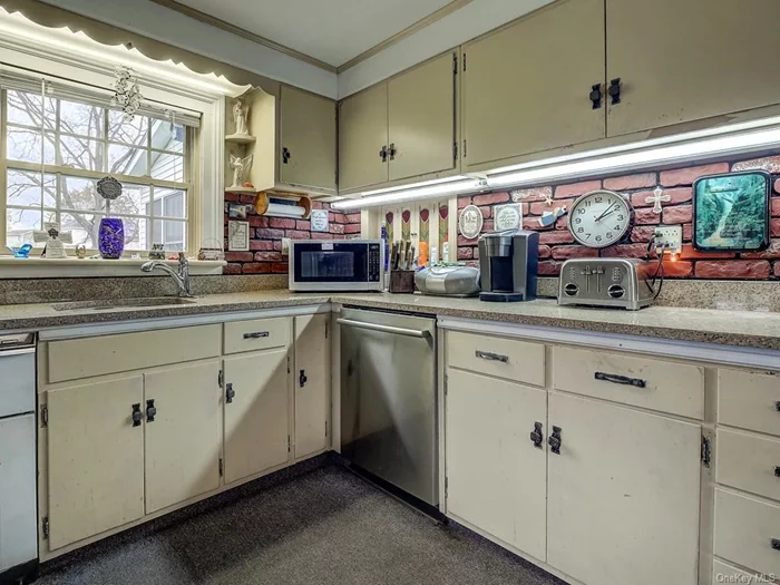 Newer appliances and granite counters in nice and airy country kitchen. Enjoy your view while washing dishes at oversized sink.