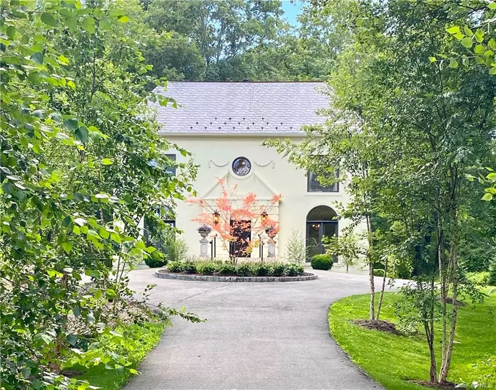 Beautifully sited on top of a knoll on 2.8 acres in one of Tuxedo Park&rsquo;s prettiest neighborhoods, this elegant Palladian-style home has just been renovated from top to bottom. The very private home is surrounded by gardens with a brook that provides beautiful outlooks from every window that make you feel as if you are in the Italian countryside. The long tree lined drive leads to a circular parking court and to the four car garage with additional space for guest parking.  With classical proportions and sweeping stairs, the entry hall opens up to the expansive and sunny living room. The living room has a large fireplace and 18 ft ceilings with a south facing limestone terrace running the full length of the home. The first floor also features a brand new, beautifully designed kitchen with clever built-ins and a kitchen garden, a formal dining room and guest bath. The home has a spacious, elegant and yet relaxed floor plan with all rooms leading one to another with large windows letting light in all day long. There is custom Stark carpet throughout the first floor and stairs providing a calm, luxurious feel that is found in the finest European hotels.  The three story home has four bedrooms and three and a half baths. The main suite has an oversized walk-in closet and spacious bath. The lower level features a media room, laundry and the perfect space for a wine cellar and access to the four car tandem garage. The floor plans indicate 3, 500 sq ft of finished space throughout with a convenient built in vacuum system. The home has been extensively renovated with a list of upgrades available upon request. The village records states that the home has 3, 000 sq ft and 4 bedrooms and 3.5 baths.  Tuxedo Park is surrounded by 70, 000 acres of forever wild parkland with lakes and trails in every direction. The area is dotted with house museums, historic sites and farms nearby and was stetted by the Dutch in the early 17th century. In the 19th century vast estates on tracks of a thousand acres or more were developed by NYC&rsquo;s wealthiest including the Harrimans, Morgans and Cooper- Hewitts. Many of these spectacular nearby estates still remain as museums, private residences, botanical gardens and soon one of them will be a luxury wellness resort.  Tuxedo Park is in the middle of these estates on then 5, 000 acres and was developed as a weekend resort for the sporting elite that wanted to enjoy an elegant country lifestyle without the maintenance of a big estate. Tuxedo Park is a gated incorporated village ( the only one in the country), that feels like you have arrived in the mountains as you pass through the stone gate house and head up to Tuxedo Lake.  The Park as it is known to the locals has an outdoor focus on lifestyle with extensive trails for hiking, snow shoeing, cross country skiing and lakes for swimming, sailing, paddel and kayaking and excellent roads for biking, all within the gated community. The historic Tuxedo Club, a private members sporting club offers, golf, tennis, sailing, swimming squash, paddle, court tennis, rowing and sunset lakeside dining was built as the center of the sporting community and remains that way today. The property has low taxes $21, 439