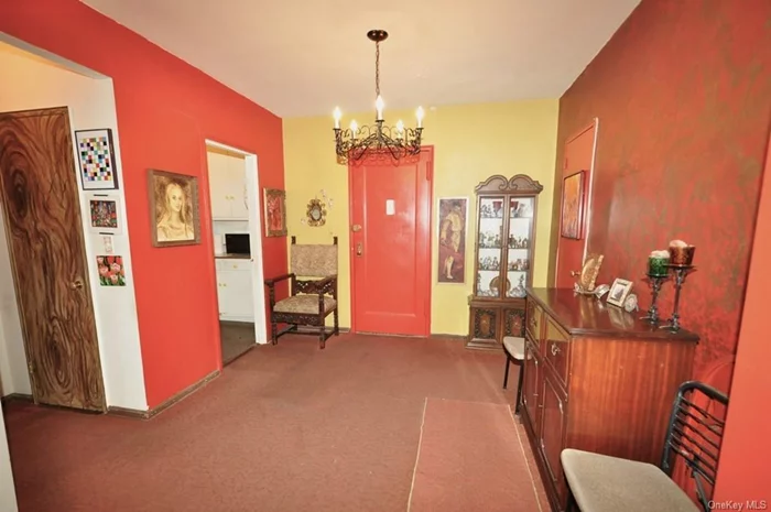 Large dining foyer opens to the living room and has covered hardwood floors.