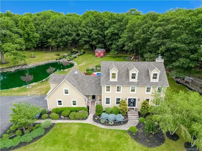 Welcome to 40 Deer Trail Road, an exquisite and unique country retreat. This custom Colonial-style home is nestled on 9.9 acres of meticulously maintained and sub-dividable property. As you enter through the two-story entranceway, you&rsquo;ll immediately appreciate the attention to detail and tasteful design, including crown molding throughout the home. The main level of the house exudes elegance and functionality. A formal dining room sets the stage for memorable gatherings, while French doors open to a private den. The chef&rsquo;s kitchen features stainless steel appliances, granite countertops, and an expansive center island. It seamlessly flows into a spacious family room adorned with a custom stone fireplace. One of the highlights of this property is the three-season room, a true sanctuary. Complete with a custom-built bar and a wall of windows, this room overlooks a private oasis, offering breathtaking views of the surrounding beauty. Just a few steps off the main level a bonus room awaits, boasting vaulted ceilings, plenty of natural light, a full bathroom, and a private entrance with a porch. On the second floor, you&rsquo;ll find three well-appointed bedrooms, a full bathroom, and a generously sized primary bedroom. The primary bedroom features a walk-in closet and a stunning ensuite bathroom, adorned with granite countertops and detailed custom cabinetry. On the lower level you&rsquo;ll find a full bathroom, an office/den, radiant heat and a walkout to a private patio with picturesque views. The outdoor amenities of this property are truly exceptional, evoking a resort-like lifestyle. Step outside to discover a 20x40 in-ground heated pool with a natural stone waterfall, surrounded by an expansive paver patio. A wood burning fireplace and a hot tub add to the ambiance, while lush gardens enhance the tranquil atmosphere. A natural spring-fed Koi Pond, a driving range, and a nine-stall horse barn with a tack room and loft cater to the horse enthusiast, providing ample space for equestrian pursuits. Completing the outdoor amenities are an outdoor riding ring, a round pen, two paddocks and a wide-open field perfect for an afternoon gallop. Practical features of the property include a new roof, a new well, a new pool liner, and a 6-zone heating. An in-ground sprinkler system ensures the lush landscaping remains vibrant and well-maintained. This property offers an extraordinary lifestyle, combining luxury, comfort, and natural beauty. Whether you seek a private retreat, an entertainer&rsquo;s paradise, or a haven for equestrian pursuits, this property is sure to exceed your expectations and is located just 60 miles from Manhattan.