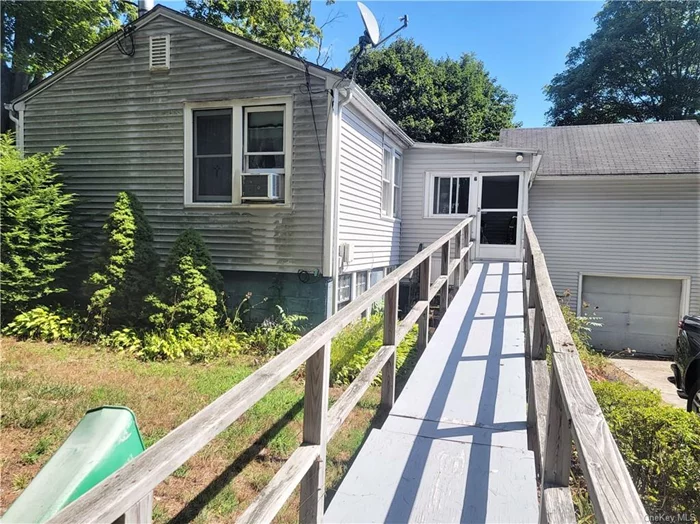 One level living in the Lake Carmel area, 3 bedrooms 1.5 bathrooms. Enclosed front porch, large living room with wood stove, master bedroom with master bath wall to wall carpet & ceiling fan. Nice rear deck with awning