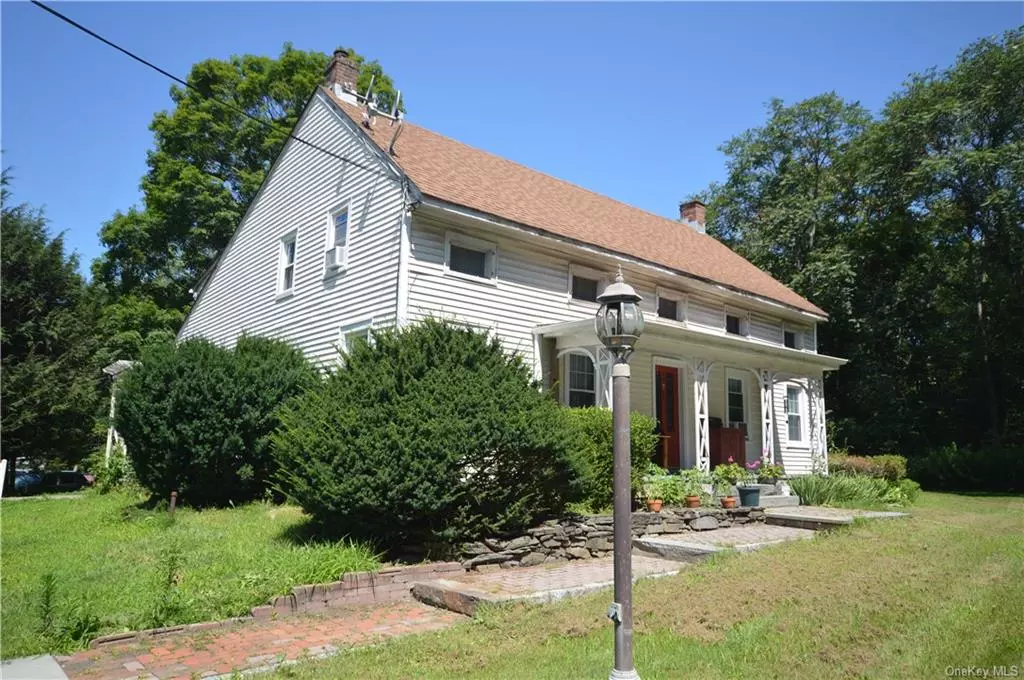 Investment property with over four and a half acres combined. Plenty of opportunities to develop this amazing site. Great visibility and traffic count. The property includes a two-family income property and an 1800 SF building currently used as an office, but formerly used as an antique shop. Possible flower shop, art gallery, etc. You decide. And an adorable red barn. A must-see!!