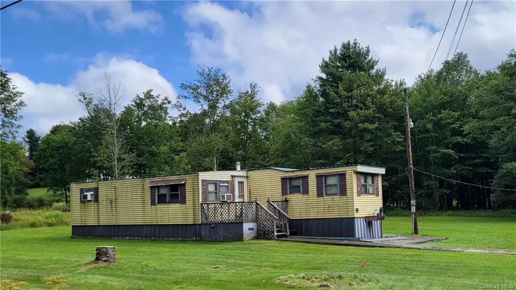 Beautiful property in a perfect location. Quiet and peaceful. Screen in deck. 2 car garage. Wood stove will stay. All on a nice 1.8 acre size lot. Close to Bethel Woods. Liberty, & Monticello.  Very affordable living! Cheaper than renting...
