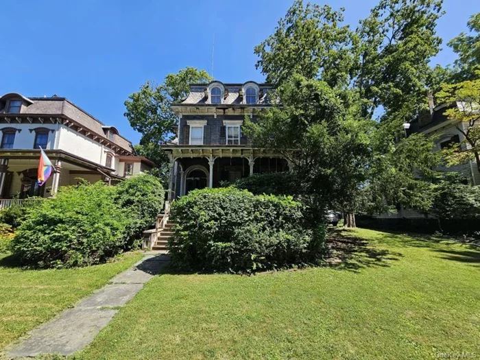 Tall and stately, rare Second Empire Style Victorian. This old charmer is patiently waiting to be loved & restored to its former glory. Located in the Historic District of Poughkeepsie, this home is already a member of the National Register of Historic Places. Just anticipating that savvy, discerning buyer who will honor & preserve this Victorian beauty. Incredible & classic details throughout the home need to be seen to be appreciated: 2 marble fireplaces and 2 wood crafted fireplace, gracious curved staircase, 12ft ceilings, and a whole-house basement. Lives like a 7 bedroom home, with plenty of options to create your dream home, in this amazing and sought after district.