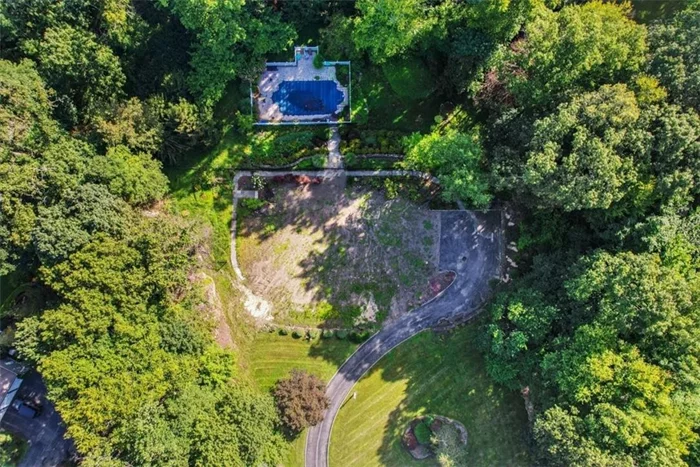 Nestled within the picturesque landscape of Cortlandt Manor, this remarkable 1.72-acre lot offers a unique opportunity to create your dream home in a tranquil & established neighborhood. Previously home to a spacious 7, 322 square-foot residence, the property retains its essential amenities, including a functioning septic system, pool, driveway, & lush natural surroundings. As you enter the property, a sense of privacy and serenity envelopes you. Tall, majestic trees encircle the lot, providing a natural buffer and ensuring a sense of seclusion. The lot is strategically located near the end of a quiet cul-de-sac enhancing the overall sense of tranquility. The pool area is a perfect oasis for relaxation and recreation, offering a private escape for warm summer days. The property&rsquo;s expansive 1.72-acre size provides ample space for your vision. With a blank canvas like this, you have the freedom to design and craft a residence that perfectly suits your lifestyle and preferences. This is a rare opportunity to build your ideal home in a well-established and idyllic setting. With existing infrastructure, a pool, and mature trees, the groundwork is laid for you to create a truly unique and personalized residence, all while enjoying the privacy and tranquility that this cul-de-sac location affords.