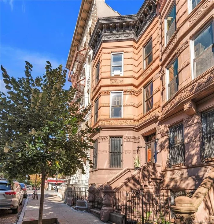 Welcome to Harlem&rsquo;s historic Hamilton Height&rsquo;s landmark district and highly sought after Sugar Hill area! This architecturally preserved 4-story townhouse with a rich history, features 7 bedrooms total, 5 baths plus a beautiful self-contained garden unit with separate entrance. Original layout and original woodwork in place. Centrally located, and tastefully updated while preserving its stunning original details and character. The townhouse easily retains its 19th century charm with beautiful Italian Renaissance wood-carved stairways, original doors, and ornate moldings, making it perfect for those looking for a unique space with unparalleled character. Enjoy the morning on the rear parlor floor deck or the charming private patio below.  Close proximity to multiple subway lines - A, B, C, D, and 1 trains, numerous great restaurants, entertainment venues and parks complete this home. Minutes away from 125th Street where you can find Whole Foods, Target, Trader Joe&rsquo;s.