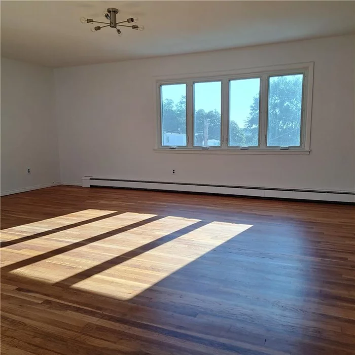 Newly renovated apartment on the top floor of a 3 Family home in Yonkers. The unit is facing east and receives lots of morning sunlight. It has a new kitchen and bathroom; the floors have been sanded and stained. Free month rent on 12 month lease