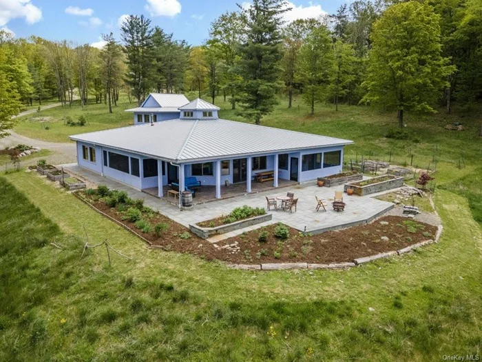 This private oasis with 88 acres, just 15 mins from Ithaca Commons. Extraordinary single-floor contemporary home with exceptional natural surroundings. Abundant windows fill interior w/ natural light, illuminating a cook&rsquo;s kitchen & an open floor plan perfect for gatherings.  Outside, hand-laid stone patios on all foursomes of the house, surrounded by lush organic gardens. A detached 2-car garage, a beautiful 750+ sq ft studio space featuring a kitchenette, half bath, & wood stove.  Adjacent cabin & serene pond add to the ambiance. All year comfort is ensured w/ radiant heat floors & ceiling-encased mini-split A/C units. A full-size sauna & outdoor shower offer relaxation, while west-facing porches provide breathtaking sunset views. Located in the Ithaca School district in the town of Danby, this property offers the perfect blend of seclusion & access to cultural attractions, colleges, & dining in downtown Ithaca.  This haven is a must-see to appreciate its beauty & tranquility