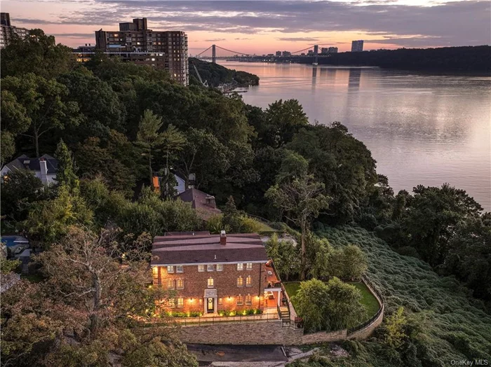 True NYC Trophy Property: An extremely rare opportunity awaits at this luxury oasis overlooking the Hudson and Palisades in NYC! No other home of this caliber available. Elite schools and public transportation nearby. Unobstructed/PROTECTED water views. Multiple outdoor spaces and vistas from all four floors. Completely redesigned and gut-renovated. Gourmet indoor kitchen and full outdoor kitchen. Grand entrance with tumbled brick exterior and heated driveway. Exceptional craftsmanship and refined finishes throughout. Four bedrooms with potential for more. Formal and informal living/dining areas. Two-car garage. Lower level with family room, dining, home theater, laundry, and storage. Duplex primary suite with fireplace and spa-inspired bath. Huge sitting room, walk-in closets, and bonus spaces. Pre-wired for backup generator. Private, sophisticated lifestyle with astounding water views. Dream address! **Pool installation subject to zoning and approvals. Current property taxes under $18, 000.**