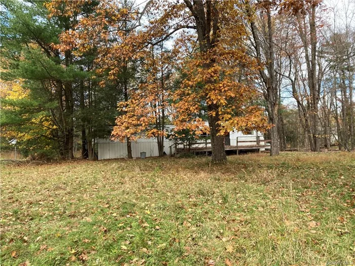 TWO SEPARATE LOTS (403 AND 405 ROCK HILL DRIVE) IN THIS SALE - .73 ACRE HAS A MANUFACTURED HOME AND .69 ACRE LOT (THE MANUFACTURED HOME WAS REMOVED). TOTAL TAXES FOR BOTH LOTS $2, 310.00. THE EXISTING MANUFACTURED HOME IS HANDYMAN, TO BE REHABBED, OR REPLACED BY ANOTHER QUAILFYING MANUFACTURED OR NEW BUILD HOME. TOWN WILL REQUIRE PLANNING BOARD APPROVAL. LEVEL LOTS, 1/2 MILE TO DOWNTOWN ROCK HILL, I-86 (NYS 17). SHORT 6 MINUTE DRIVE TO MONTICELLO, 18 MINUTE DRIVE TO MIDDLETOWN, AND I-84. 20 MINUTES TO BETHEL WOODS MUSIC HALL (WOODSTOCK MUSIC MUSEUM, ETC.) 6 MIUTES TO THE NEW RESORTS CASINO, AND KARTRITE YEAROUND WATER PARK.  VERY CLOSE TO HOLIDAY MOUNTAIN SKI HILL AND RECREATION PARK, STATE LAND, LAKES, RIVERS, AND SO MUCH MORE. ELECTRIC METER FOR #405 STILL IN PLACE, METER BOX INTACT ON 403 NO METER PRESENT. ONE WELL HAS BEEN LOCATED, SEPTIC UNKNOWN LOCATION OR TYPE.