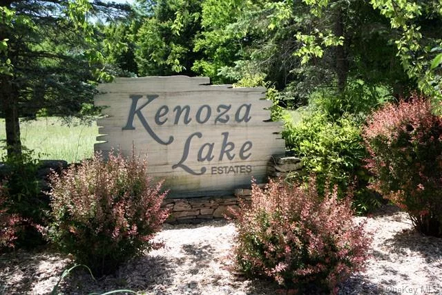 This wooded lot in Kenoza Lake Estates has a view of Hust Pond and deeded access to the beach and boat launch on beautifully pristine Kenoza Lake. Kenoza Lake Estates is a private, gated community that offers a quality environment in tune with nature -- just 2 hours from NYC. Both Hust Pond and Kenoza Lake are non-motorboat lakes, so you can enjoy the quietude of your lake house in the woods, or go for a paddle or an afternoon&rsquo;s fishing without being disturbed. This 5-acre lot is both level and gently sloping, lightly wooded with hemlocks and hardwoods. Build close to Hust Pond and you can gaze out at water and watch wildlife. Nicely located close to all the excitement and amenities of several Catskills hamlets like Callicoon, Jeffersonville, and Narrowsburg, yet completely private and quiet. Take the back roads to Bethel Woods and avoid the crowds! Come experience the best of country living in the western Catskills.