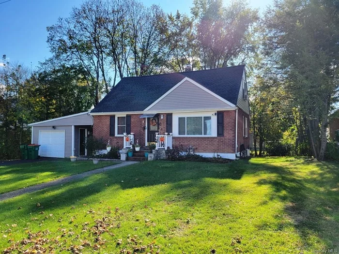 Beautiful Cape Cod home located on a quiet cul-de-sac. Renovated in 2022 with updates throughout the property, including roof, windows, siding, 200 amp electric, new carpet in upstairs bedrooms, refinished wood floors and fresh paint. Kitchen boasts stainless steel appliances and quartz countertops, with walkout access to deck. Updated bathrooms on 1st and 2nd floors. Two 1st floor bedrooms; two large bedrooms on 2nd floor. Recreation room in basement area is great for family room, playroom, home office or gym. Above-ground oil tank and utilities in basement. One-car garage with breezeway. Spacious, level, park-like private yard. Town water/sewer. Natural gas available. Driveway sealed Fall 2023.