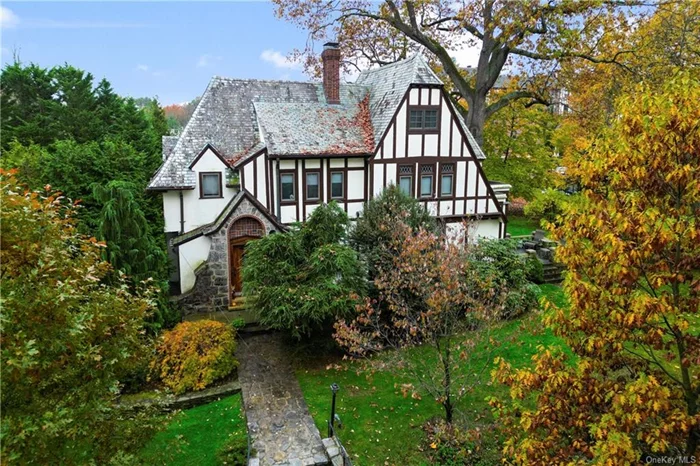 Start the good life in 2024 in this elegant Tudor in Pelham Manor on a half-acre property with room for a pool and just two blocks from everything you need preschool, Siwanoy K-5 elementary school, stores, restaurants, coffee shops, and 2 dog-friendly parks. Standing proudly on a gorgeous block, 590 Monterey Avenue offers 4, 000 sf of well-laid-out living space including a private paneled office, an eat-in kitchen, formal dining room with bay window, and a large family room/sunroom on the first floor where you can step out to a large stone patio. Beamed ceilings, chestnut woodwork, and large stained glass windows make this home unique. A custom-built glass-enclosed solarium for your plants, where you can enjoy a morning cup of coffee or evening glass of wine, and a marble fireplace add to the charm and specialness of this forever home. Upstairs the bedrooms are a generous size and enjoy abundant natural light all day. The main bedroom suite with a dressing room and marble bath is enhanced by unique curved moldings over the large windows. Enjoy the convenience of multi-zone gas heat and central air conditioning and an attached two-car garage. Finished and dry basement with natural light adds another 500 sf including a large playroom and separate exercise/office space. gorgeous well well-maintained slate roof adds to the curb appeal. And, as a resident of Pelham Manor, you have year-round access to Shore Park, a 4- acre park located on the Long Island Sound Waterfront. See this home today before it&rsquo;s gone!