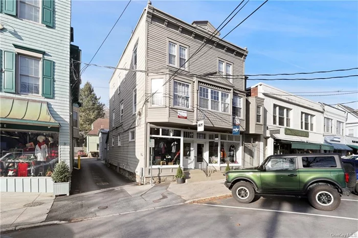 Charming 33x52, 3 story building on Katonah Avenue in high visibility center of village along foot traffic sidewalk. 2 Bedroom apartment on 2nd floor & 2 Bedroom apartment on 3rd floor. Separate 2 Bedroom cottage with storage below at rear of property. The property abuts additional buildings also for sale by Owner with frontage and access from Parkway. See 24 Parkway on mls. A rare find in the heart of Katonah! Both properties offer a terrific opportunity for expansion/development of these prime Katonah locations for mixed use. Sewer connection is provided.