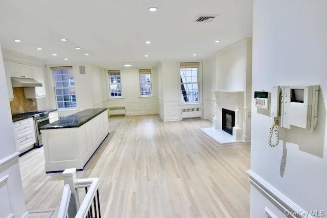 Steps to Central Park and centrally situated in the heart of Manhattan&rsquo;s exclusive Upper East Side neighborhood, this very rare 25&rsquo; Townhome with Professional Space can now be yours. The property offers approximately 7500 interior SF (including cellar), a 1200 SF (Approx) Private Backyard in addition to a 500SF (Approx) Private Roof Deck. Impeccably designed, the building is comprised of two entrances, one leading to a 3000SF (Approx) 3bed, 3 bath Triplex with home office and Private Roof Deck; the other leading to a state-of-the-art 4300 SF Professional Space (currently medical). Ideal for Owner / User, Investment and can be easily converted to a Single Family. The property can be delivered vacant. The interior of the Residence has recently been updated and boasts the following features: -Brand new top-of-the line appliances (Bosch) -Recently renovated hardwood oak flooring -Custom facade with large antique entry doors - Private elevator -Private Roof Deck with large storage room -Gas Burning Fireplaces -Central HVAC Units (Separated) -Acoustically-Rated Marvin Windows throughout building -Custom wood molding throughout building -State of the Art Video Surveillance / Intercom with Integrated Alarm / Smoke / Carbon Monoxide Detectors -Floors and Supports Reinforced with Steel -Custom Gates and Fencing with Exclusive Access and Protection -Video Surveillance on Roof and Backyard -New Roofing and Skylights The Professional Space, to which the Private Backyard is adjoined to, is currently a Medical Office occupying the 1st and 2nd floors and measures 3000 SF (Approx) Ground level and 1500 SF (Approx) Cellar. There is a large storage room and washer dryer on the premises. The property is ideally located one block from the 4, 5, 6 trains, 2 blocks from the Q train and steps to restaurants, 86th Street, Whole Foods, Target and Fairway.