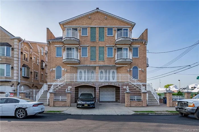 Introducing for the first time, this 2003 custom built semi attached two-family with bonus walkouts from lower level located in the Locust Point Estates area of Throgs Neck. Offering 4073 above grade square footage with an additional 1162 lower level bonus square footage and 219 sqft garage. The two units consist of a triplex four bedroom, 3.5 bath unit with views from a deck off the first floor and terraces. The second unit is a duplex two bedroom, 1.5 bath apartment with a balconies. Both units have their own laundry within their apartments. Parking for two cars, one garage and one driveway. 2 bonus finished walk-outs on lower level. Excellent water views from several rooms in the home. Special features: 3 gas fired boilers; 2 gas fired hot water heaters; 3 electric meters.
