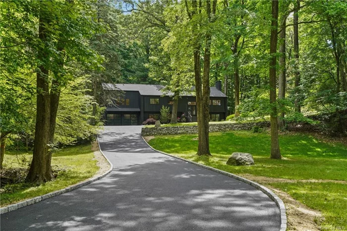Newly updated Modern nestled on five private acres in the prime estate location in Bedford. This property is introduced by pillared stone columns and is perched up a long drive for complete privacy yet is just moments to everything, including 5 min to both train and town. The main level offers open concept, light infused living with gorgeous vaulted ceilings and doors out to the new entertaining deck and patio. The expansive kitchen features stainless steel appliances, custom cabinetry and quartzite countertops plus a fabulous bar room/butler&rsquo;s pantry with sink and wine refrigerator. The large lower level with a private entrance offers endless possibilities for work, play, guests and more and includes a family room with fireplace, gym, guest/nanny bedroom, full bath, mudroom, laundry and garage. Explore the property or relax and entertain on the deck and stone patio. Great pool sites. Walk to Rochambeau Farm to visit the baby animals and pick up fresh produce and baked goods or hike the local preserves.