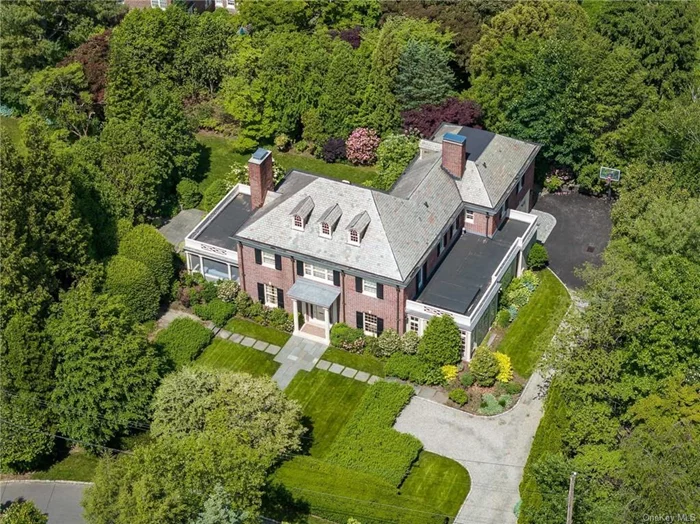 Rare opportunity to own a piece of Bronxville history. This beautifully maintained 5-bedroom, 4 full bathroom, 2 half bathroom home is set on nearly a half-acre in one of the most ideal Bronxville Locations is now available. This 1929 classic Georgian Center Hall Colonial designed by renowned local architect Lewis Bowman is ready for its new owners. The welcoming cathedral ceiling entry foyer with views to the rear yard sets the opening impression of elegance and grace. To the left is a stately living room with wood burning fireplace and easy access to a beautiful three season room. Entertaining at this home offers an effortless flow from the formal living into a generously sized dining room leading into a sun filled family room with French doors to the side yard. The dining room offers a second passageway to the well-situated butler&rsquo;s pantry with access to the kitchen. The Kitchen has been tastefully updated, it includes Gaggenau cook top, center island, sub-zero refrigerator, Thermador double wall oven and tons of storage space. Comfortably sized breakfast room/den offers a door to the outside patio. The flow of this space keeps the heart of the home centered around the kitchen. The first floor offers 2 powder rooms, mudroom area, laundry and access to the attached 2 car garage. The grand front staircase leads to the second-floor bedrooms. The primary bedroom with walk-in closet and en-suite bathroom, office, 4 additional bedrooms and 3 additional bathrooms with back stair to the breakfast room/den complete the second floor. Exterior living space offers award winning gardens and the utmost in privacy and spectacular lash colors in all three seasons. The basement and attic offer a great amount of space and storage, are unfinished with significant potential. Close to Village, Shops, Parkway and a 29 Minute Train ride on Metro North to Grand Central Station. Close distance to Siwanoy Country Club and Bronxville Field Club.