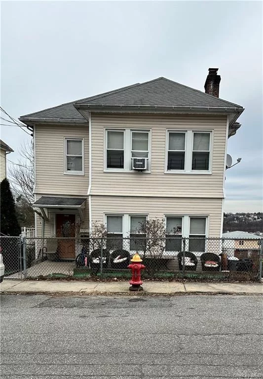 Great 2 family home or investment! Each apartment has an eat-in-kitchen, dining room, living room and working fireplace. The first floor unit is a 2 bedroom with a bonus room and the basement is finished for extra living space. There is a large 2 car garage, long driveway and back yard.