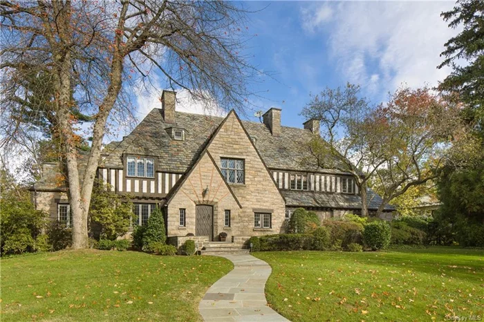 Now&rsquo;s the time to take a look at this light and airy English Country house designed by the acclaimed architect George Root in the renowned Bronxville School district....it&rsquo;s a very special new offering. 3 Westway is beautifully sited on almost a full acre of level property in an estate-like neighborhood of equally exquisite homes. The exterior shows off handsome stonework, magnificent chimneys, a heavy slate roof and expansive leaded windows flooding every room with light.  The beautiful interior is defined by a handsome oak paneled foyer which introduces a step-down living room with barreled ceiling, a handsome fireplace and expansive leaded windows.  A sun-filled home office or den is adjacent to the living room and opens to a large bluestone terrace, garden and lawn. A most charming and cozy pine paneled family room with corner fireplace and french doors also leads to the terrace. A gracious family dining room as well as delightful breakfast room open to a sleek and modern Cook&rsquo;s kitchen and pantry. A homework room or playroom is proximate to the kitchen.... a convenient back stairway as well as 2 pretty powder rooms and entrance to the heated garages complete the first floor. A magnificent oak stairway leads to plenty of bedrooms and modern baths including a spacious master suite with two walk-in closet and a serene master bath with his and her water closets with sinks, a soaking tub and shower.  The 2, 000 sf lower level features a terrific playroom with fireplace, a gym, a wine cellar, laundry, powder room and house mechanicals. In addition, there is a detached, architecturally complemented two car garage creating garaging for five cars as well as plenty of extra space-plenty of room for a golf simulator? This magnificent, well-maintained residence with its beautiful, expansive property offers a wonderful balance of gracious living in an exceptional setting for entertaining without sacrificing any comforts of a warm family home.