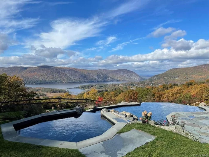 Welcome to Paradise! Poetry in motion. Spectacular summer rental that offers privacy and luxury with a breathtaking 180 degree views of the Hudson River, the Hudson Highlands and the Catskills. The house is newly renovated in 2020- 2024. An In-ground Infinity Pool, oversized Hot Tub w/views over the Hudson River. Complete renovation/extension of the KIT & Pantry. Wolf Gas Cooktop, Double Ovens, Micro Wave, Warming Oven, double door Sub Zero Refrigerator, Wine Cooler, Calacatta Marble Counter tops, Custom Cabinets, new Primary Bath w/Soaking tub, double glass shower, new 2nd Bth, Powder Rm, converted lower level into a LR/Play Rm, BR & Bth w/views of the Hudson river. All new windows & doors in KIT, LR & foyer, including 12&rsquo;x 24&rsquo; windows that offer dramatic views of the Hudson. New metal roof & a Tennis Court as well. The river views, the stunning spacious/open floor interior come together to create an unforgettable getaway experience. The ultimate all inclusive retreat, 1 HR from NYC.