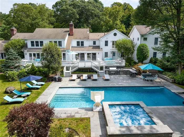 Experience refined luxury and casual elegance in this exquisite home located amidst the serene Whippoorwill neighborhood of Armonk. Lush and private, the 2+ acre property is set behind gates that are a picturesque backdrop to a private oasis. The amenity driven outdoor space was built for entertaining featuring a stunning saltwater pool & spa, expansive patios and decking, & fully fenced, park-like lawns. This exquisite home has been expanded & renovated to perfection offering relaxed contemporary living. The bespoke chef&rsquo;s kitchen is both beautiful & functional with state-of-the-art appliances, dual sided fireplace & breakfast area that opens to the expansive deck. The grand room provides a cozy gathering spot by the fireplace as well spacious everyday living, while a handsomely appointed dining room is perfection for holiday gatherings. A sumptuous primary suite with fireplace offers approximately 1750SF of private space including two dressing rooms, spa bathroom w/fireplace, office with wet bar, 2nd bedroom or office with ensuite bathroom and French doors out to a private deck. This 7 bedrooms home has room for all. Separate 1 bedroom apartment for guests or staff and a 5+ car garage for the car collector. An offering like no other.
