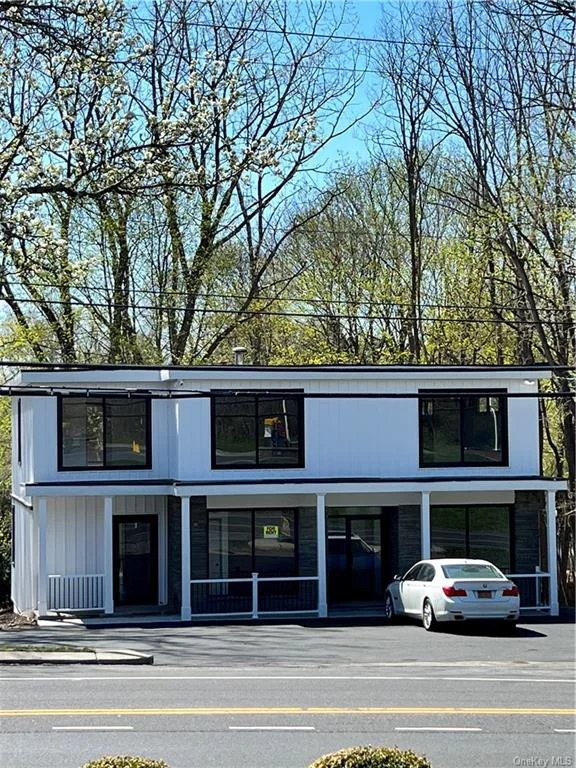 Professional Office Building for Lease. ALL utilities are included with the lease. The building is comprised of multiple office suites. The Tenant will have a private entrance with 1 office suite and bathroom on the lower level. The renovated building with a modern exterior features white board and batten siding, large windows, updated lighting, new flooring, and fresh paint. Perfect for an Accountant, Lawyer, Architect, Real Estate, or any other Professional use.