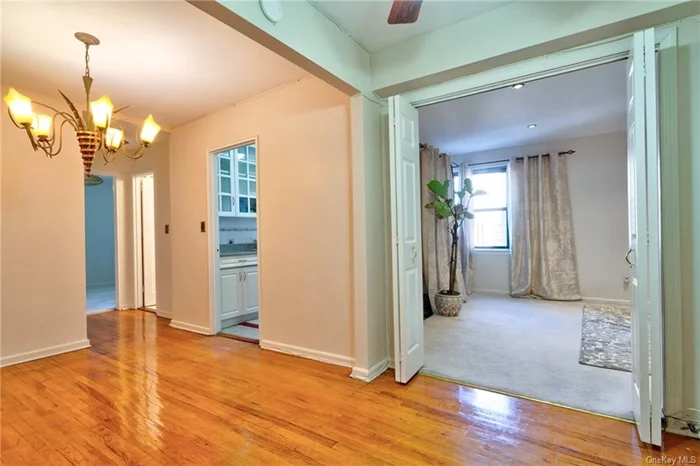 A perfect blend of comfort & convenience, this 1BR, 1BA, 750 sq.ft located on the residential Pelham border of Mt Vernon. This sun-filled home features gleaming hardwood floors and an open flow. The renovated bath, updated kitchen and generous closets creates a warm and welcoming space to call home. Enjoy access to a private event space perfect for hosting gatherings, and garage for secure parking (Waitlist). Onsite laundry and maintenance staff. Additional storage available. Just steps from public transportation and a 20min stroll to the Pelham Metro North Train, living in this beautifully landscaped community makes commuting a breeze.   The $768 monthly maintenance does not include $2000 annual STAR REBATE, providing additional savings. Own for less than $1600/month; 705+ Credit,  65K income, 6mos maintenance in reserve, DTI under 28% - 30%. Financials available upon request.