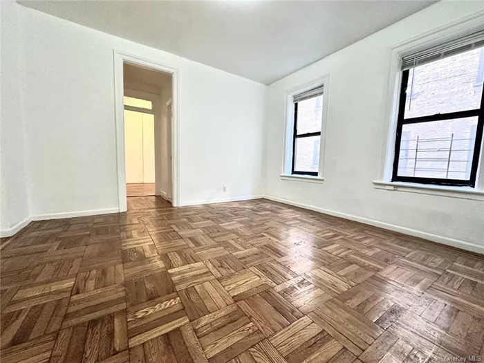 This spacious 1 bedroom is 2 blocks away from Inwood Hill Park and across the street from Isham Park, where you will find a weekly farmers market every Saturday. The apartment boasts brand new hardwood floors, marble bathroom, a renovated kitchen with brand new appliances and ample closet space. Steps away from the A express train at 207th.