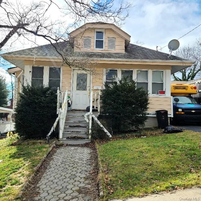 This 2 bedroom, 2 bath home is located on a quiet cul-de-sac. It has a 3 season porch and a detached garage. Please do not disturb the occupants for any reason. Being sold as-is via auction. Buyer to assume responsibility for occupants. Cash Only.