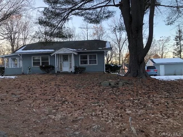 Small ranch sitting way back from road on 2 acres. Large living room, eat-in kitchen with back door to enclosed porch. New range and refrigerator. Washer, Dryer. 2 bedrooms, small sun room off living room. Partial basement. Enjoy total privacy or you could even build a new house - lot is subdividable!!  Close to Route 9 and shopping!