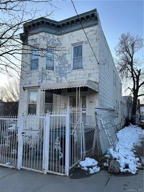 This a Beautifull 3 bedrooms 1.5 bath over 3 bedrooms 1 bath over a 2 bedroom in the back of the building, nice big yard, garage in back detach. This house needs some work and will not get approve for a regular loan.