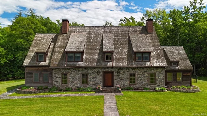An outstanding example of Dutch stone architecture, 73 Mill Dam Road exudes the rich history of the Huguenots immersed in the local charm and natural surroundings of magnificent Hudson Valley, New York. Inspired and designed after the Jean Hasbrouck House in Huguenot village located in New Paltz, this home was built in 2002 with the design, craftsmanship, and detail of the eighteenth century. It includes original stone from the local quarry; wood beams, doors, flooring and staircases milled from the property&rsquo;s oak, pine and cherry trees and iron hardware on doors and railings made specifically for this home. There is a left and right wing - each with its own living room with fireplace, electrical service, hot water heater and central air conditioning system. Seven bedrooms, each with an ensuite bathroom, a beautiful chef&rsquo;s kitchen, third floor media room complete with wet bar and a vaulted ceiling, lower-level recreation room and den, end-to-end exterior deck and in-ground pool complete this breathtaking 10, 000 square foot estate. Set on 70 park-like acres, the property includes ponds, streams and various species of forest  your own oasis of privacy, tranquility and peace, conveniently located close to New Paltz, Rhinebeck, and Kingston which is rich in history and the arts.
