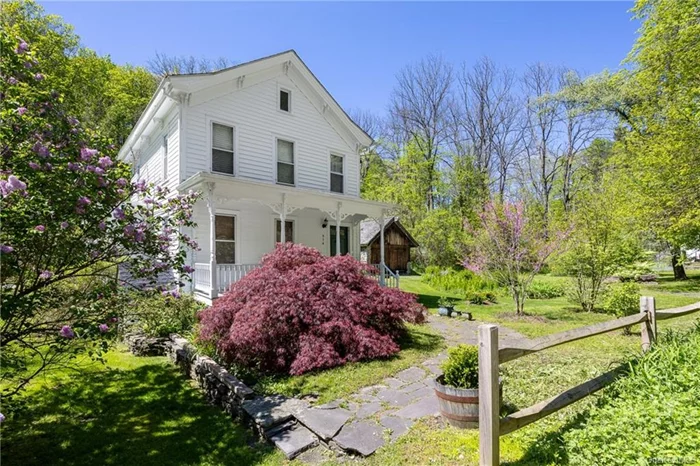 This thoughtfully renovated farm house is the proverbial needle in a haystack for Hudson Valley buyers: a move-in-ready 19th-Century propertywith well-preserved charm but plenty of modern updates, plus privacy, quiet and convenience, too. Situated on 1.6 acres, with an additional .2-acre build-able lot across the lane, the house has been expanded to include a new entry foyer, full bathroom and spacious living room on theground floor, now opening through French doors to a spectacular glass-roofed 4-season sunroom that takes full advantage of the surroundingview of hillsides and gardens. Warm and stylish is the tone throughout, from the original front porch featuring carefully restored period brackets, all the way through the original front parlor, now suitable for use as a ground-floor bedroom, and the light-filled and beamed dining and kitchenarea featuring Sub-Zero and Wolf appliances and a charming window-bed nook. Upstairs are 2 sunny bedrooms featuring custom built-instorage, an additional full bath, and access to a spacious attic. Numerous recent updates include central air conditioning, a new roof, a new oiltank, high-end replacement windows, and an exterior paint job. Outside, the property features lovely mature trees and plantings, plus a uniqueBavarian-style garage. The separate parcel across the lane, once the site of a house, and with its own well and septic system still in place, isready for construction of a new house or studio. Replete with all the charms and privacy of a rural farm house, the property is also centrallylocated, with the popular Wallkill Valley rail trail, Uptown Kingston and the village centers of Rosendale, New Paltz and Stone Ridge all justminutes away.