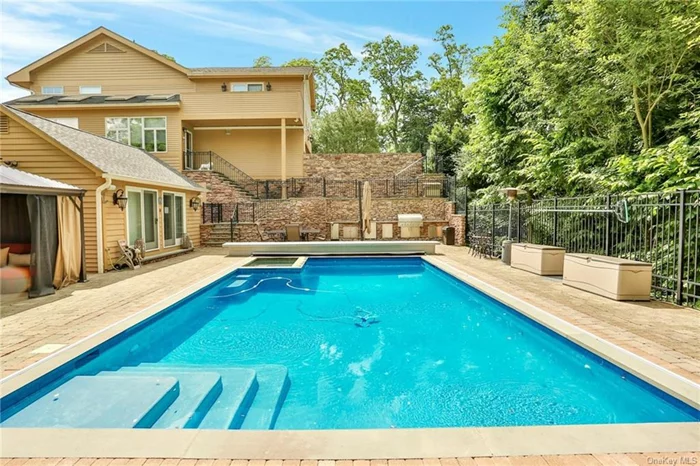 Are you in the POOL of buyers who want more than just a new home? Looking for a total lifestyle? Are you a mover & shaker? Then don&rsquo;t miss 220 Quaker! Just come on in, the water&rsquo;s fine! A sheltering portico announces your arrival as you step inside this home which feels like a mini estate. A large & light welcoming entry foyer invites you to slip off your shoes (feel the toasty warmth of radiant floor heat), hang your coats and come through the French doors into a center hall which holds a large closet. Off to the luscious living room replete with a dual-sided wood-burning fireplace with custom mantle, a wall of windows, skylights & glass doors out to the lushly planted, large level yards (yes that is plural!) Beyond the living room is a seriously designed work-from-home office with 2 entrances which allows it to be purposed as command central for organizing your life, your business, or meeting clients, patients, day-trading it&rsquo;s a real office! An open flow plan carries you into a butler&rsquo;s pantry with its wet bar, a beverage fridge & custom cabinetry with space to hold as much fun as you wish! A formal dining room with a partially vaulted & skylighted ceiling is perfectly proportioned to hold all your delicious gatherings with friends & family and is tastefully appointed with crown & chair rail moldings plus warm & richly grained hardwood flooring. A wide, welcoming entryway ushers you in the fully accommodating chef-level kitchen featuring a center island with breakfast bar, a hammered copper sink, leathered granite counters, a 6-burner Wolf cooktop, pot filler spigot, double wall oven, custom backsplash, a Sub-Z fridge, all the prep & pantry space you will ever need and yet another partially vaulted ceiling with skylights for an abundance of natural light! A separate double-door pantry provides & a main level powder room & plenty of closets make life convenient. All this plus a door out to Shangri-La also known as one heck of a swimming pool, pool deck, pool house with A/C & powder room & a complete summer kitchen with grill, refrigeration, ice-maker like we mentioned lifestyle! Upstairs you&rsquo;ll find an open landing with a huge picture window that sets the stage for what&rsquo;s in store. The Primary en-suite bedroom is a sanctuary with walls of windows, cathedral ceiling, skylights, a true-walk in closet, glass doors out to a private balcony, additional closets & a spa-like bathroom with radiant floor heat, a glass enclosed shower, separate jet tub, & private WC. Three additional large & light bedrooms with multiple exposures & ample closet space plus a large linen closet and full hall bath with radiant heat & spectacular tile work rounds out the second floor. We mentioned mini estate, so you know there&rsquo;s more to explore! A lower-level dream space holds separate bonus rooms, a fitness center that looks like it should require membership, and a terrific laundry room all add flexible lifestyle choices. The sliding glass doors out to the enormous al-fresco dining deck, fully fenced terraced yards and back to the pool simply makes life full of LIFE! Radiant heat (8-zones), 4 heating zones, central air-conditioning, under-stair storage, a tricked out 2-car garage plus a driveway that can hold 8 cars . a mini estate indeed! Come see the splendor & you will be a taker for 220 Quaker!