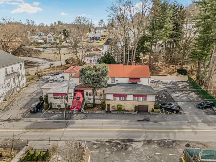 Great Investment opportunity in the heart of Thornwood. Large restaurant building occupied by a well-established and successful restaurant/catering business along with two residential units AND a 5, 000 square foot lot directly across the street. Call for more details.